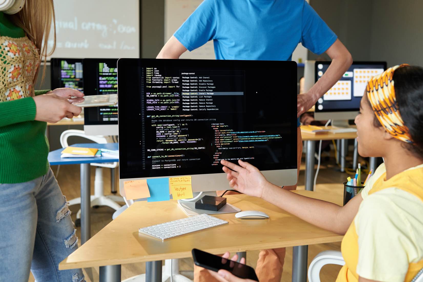 students-discussing-computer-codes-on-computer-2025-03-18-22-19-21-utc